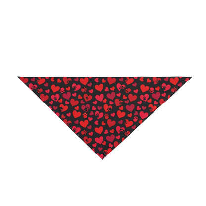 Against a white backdrop, a Dogs Pure Love black bandana is displayed with red hearts and paws.