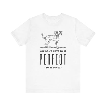  Against a white background, the Dogs Pure Love white unisex t-shirt prominently features the slogan 'You don't have to be perfect to be loved.'