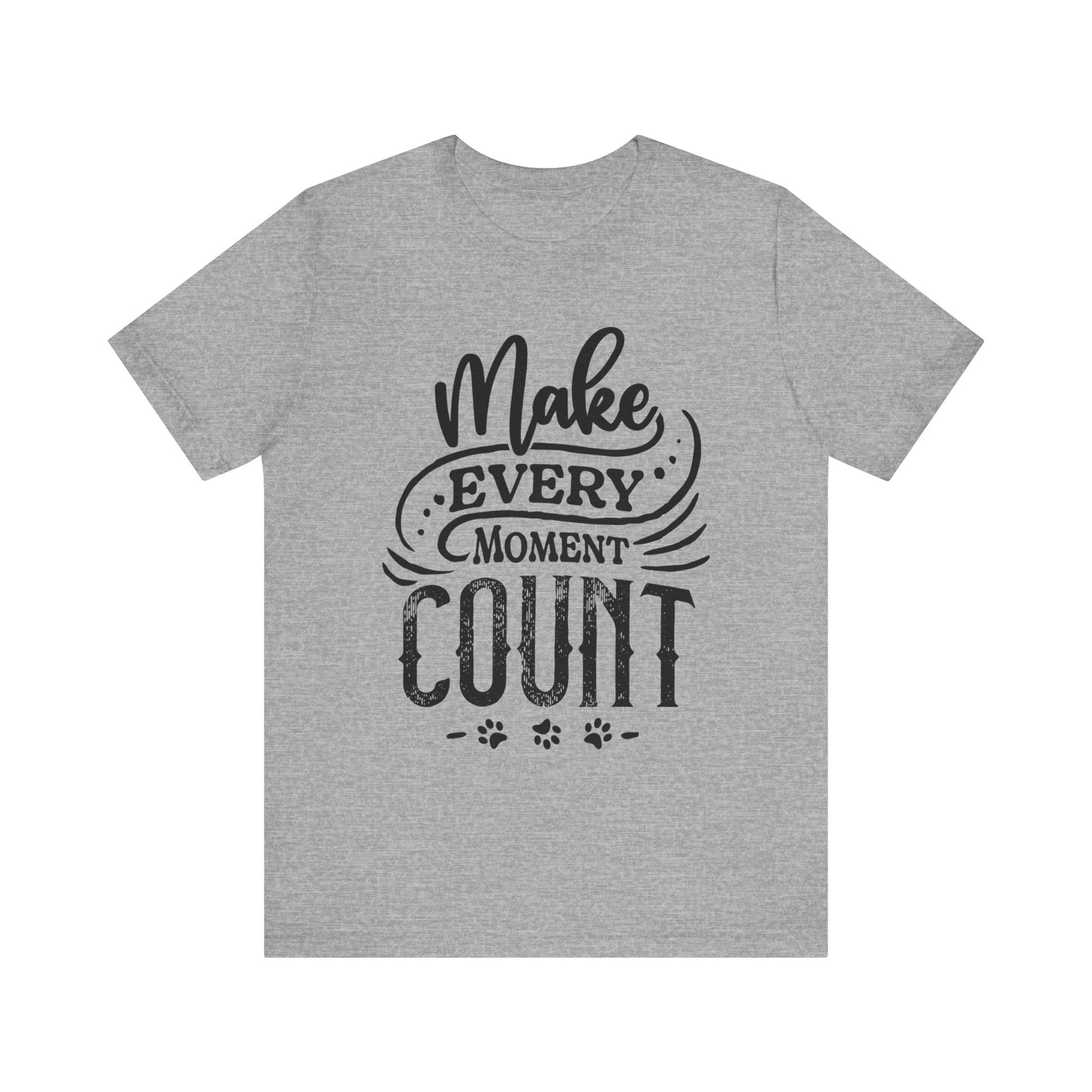 A heather grey Dogs Pure Love unisex tee, displays the slogan 'Make Every Moment Count,' against a white canvas.