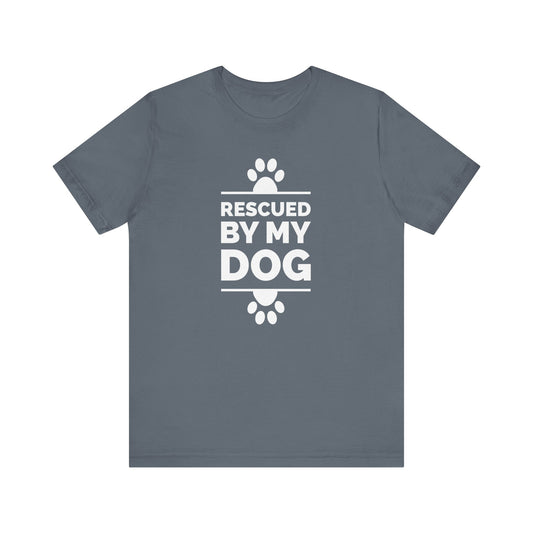 A Dogs Pure Love steel blue unisex tee, features paw prints and text 'Rescued by my Dog,' against a white canvas. 