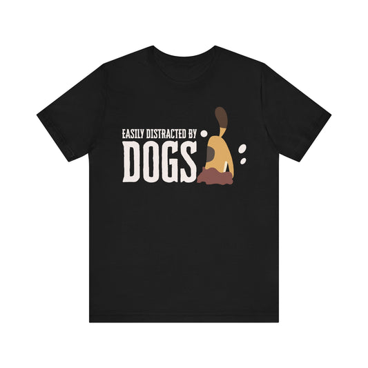 On a pristine white surface, a Dogs Pure Love black unisex t-shirt features a graphic of a dog digging, with the slogan ‘Easily Distracted by Dogs.’