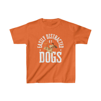  On a white canvas, a Dogs Pure Love orange unisex kids t-shirt showcases a charming graphic alongside the slogan 'Easily Distracted by Dogs.'