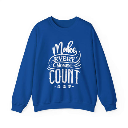  A Dogs Pure Love unisex royal blue sweatshirt, with the inspiring slogan 'Make Every Moment Count,' is showcased against a white backdrop.