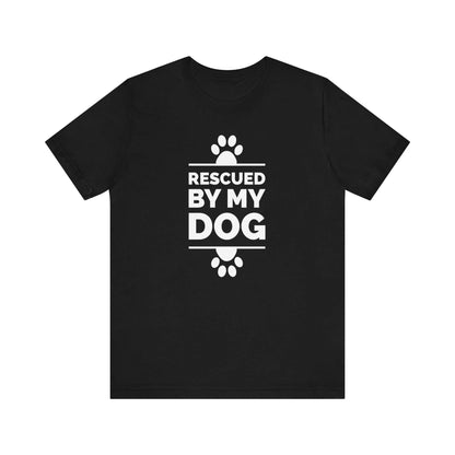  On a white canvas, a Dogs Pure Love black unisex tee displays paw prints and the phrase 'Rescued by my Dog.'