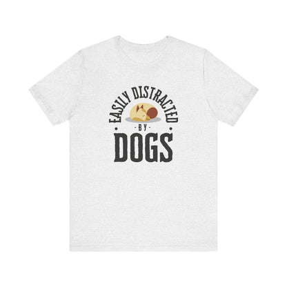  A Dogs Pure Love 'Easily Distracted by Dogs' ash-colored unisex t-shirt, featuring text and graphics, rests against a clean white backdrop.