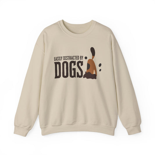 Surrounded by a white backdrop, a sand colored ‘Dogs Pure Love, Dog Dig’ unisex sweatshirt features a dog digging with the slogan ‘Easily Distracted by Dogs.’