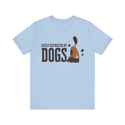 With a white backdrop behind, a Dogs Pure Love baby blue colored unisex t-shirt features a dog digging with the slogan ‘Easily Distracted by Dogs.’