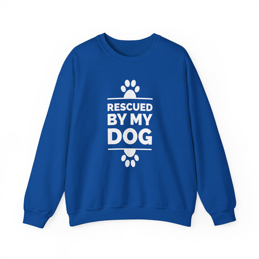 On a white backdrop, a Dogs Pure Love royal blue unisex sweatshirt features charming paw prints and the heartfelt message 'Rescued by my Dog.'