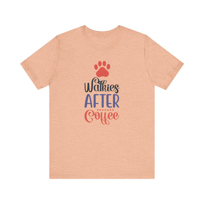 The heather peach colored unisex tee by Dogs Pure Love proudly showcases the slogan 'Walkies After Coffee,' admits a white backdrop.
