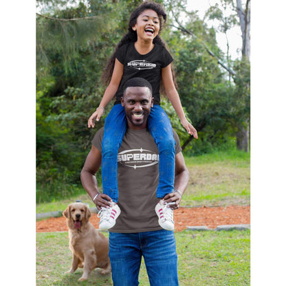  In the background, a Golden Retriever looks ahead as a father gives his daughter a shoulder ride. Both father and daughter are wearing Dogs Pure Love 'Superdad and Superkid' tees.